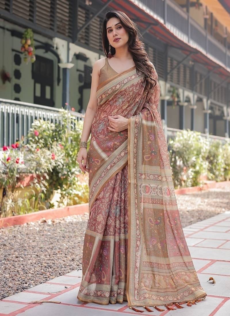 Rust and gold handloom cotton-linen saree with floral motifs and rich zari border