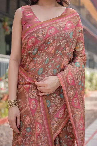 Copper brown handloom cotton-linen saree with floral motifs and vibrant pink accents