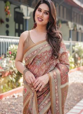 Rust and gold handloom cotton-linen saree with floral motifs and rich zari border 1