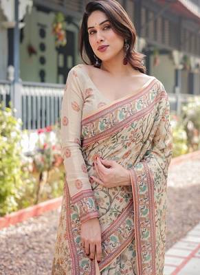 Ivory handloom cotton-linen saree with floral and peacock motifs, zari highlights, and tassel finish 1