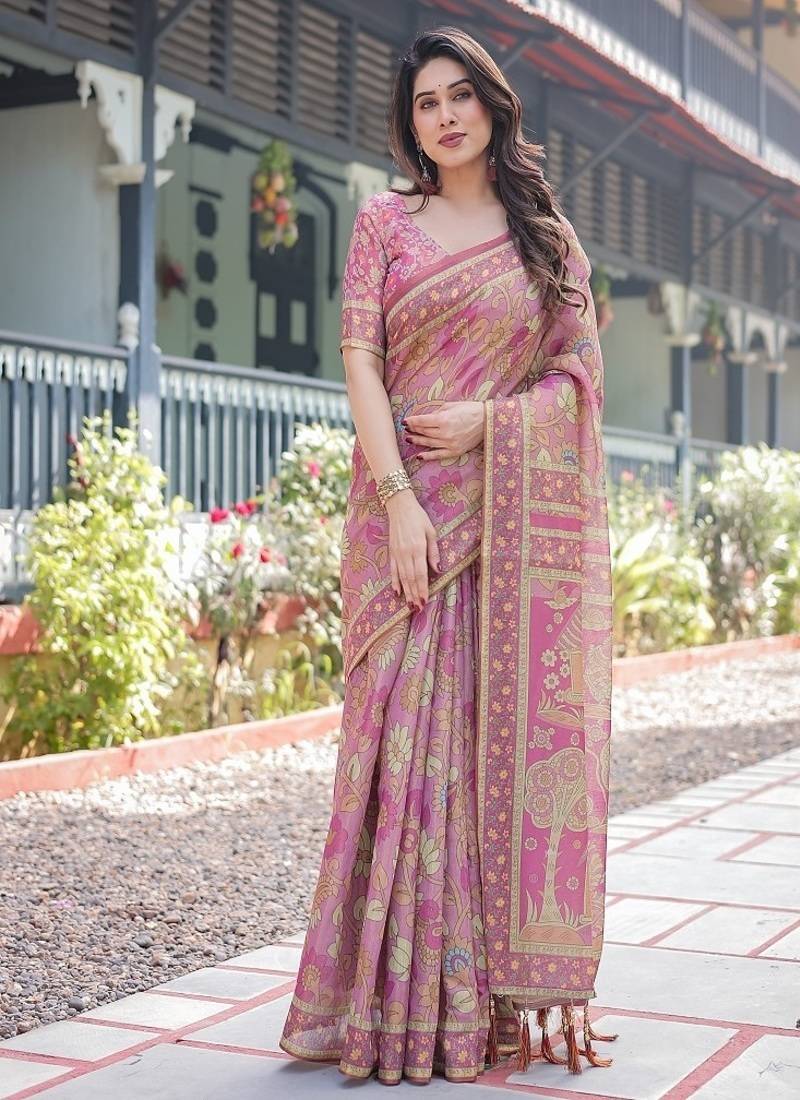 Regal pink handloom cotton-linen saree with floral motifs, golden zari highlights, and tassel detailing