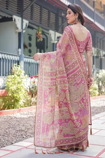 Regal pink handloom cotton-linen saree with floral motifs, golden zari highlights, and tassel detailing