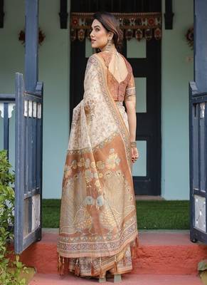 Ivory handloom cotton-linen saree with floral and peacock motifs, zari highlights, and tassel finish 3