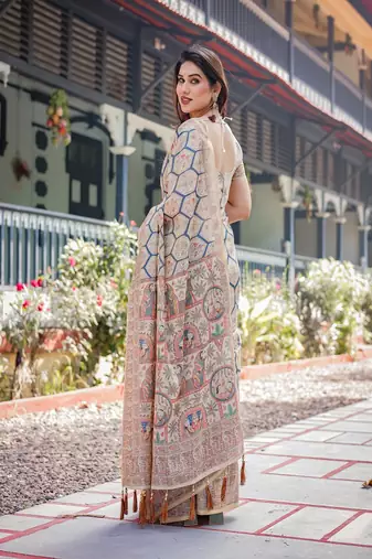 Classic beige handloom cotton-linen saree with madhubani-inspired prints and zari highlights