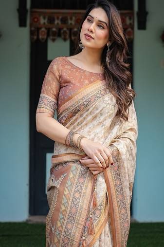 Ivory handloom cotton-linen saree with floral and peacock motifs, zari highlights, and tassel finish