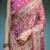Pink handloom cotton-linen saree with gold floral motifs and peacock pallu