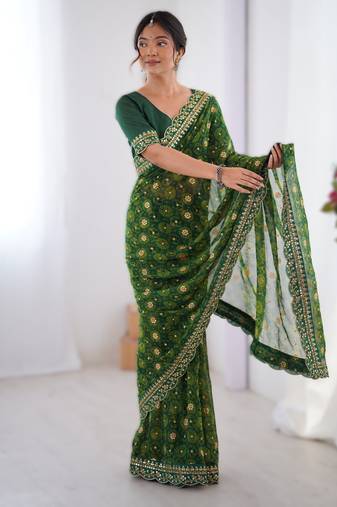 Green floral printed georgette chiffon saree with foil work & embroidered lace border