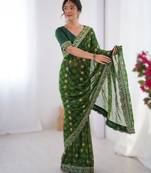 Green floral printed georgette chiffon saree with foil work & embroidered lace border