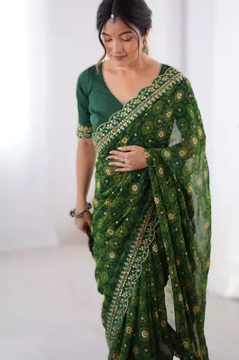 Green floral printed georgette chiffon saree with foil work & embroidered lace border