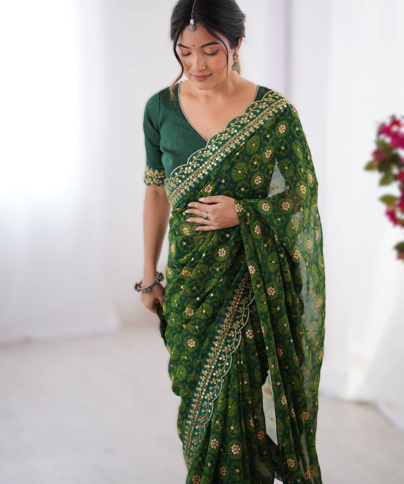 Green floral printed georgette chiffon saree with foil work & embroidered lace border