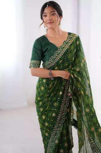 Green floral printed georgette chiffon saree with foil work & embroidered lace border