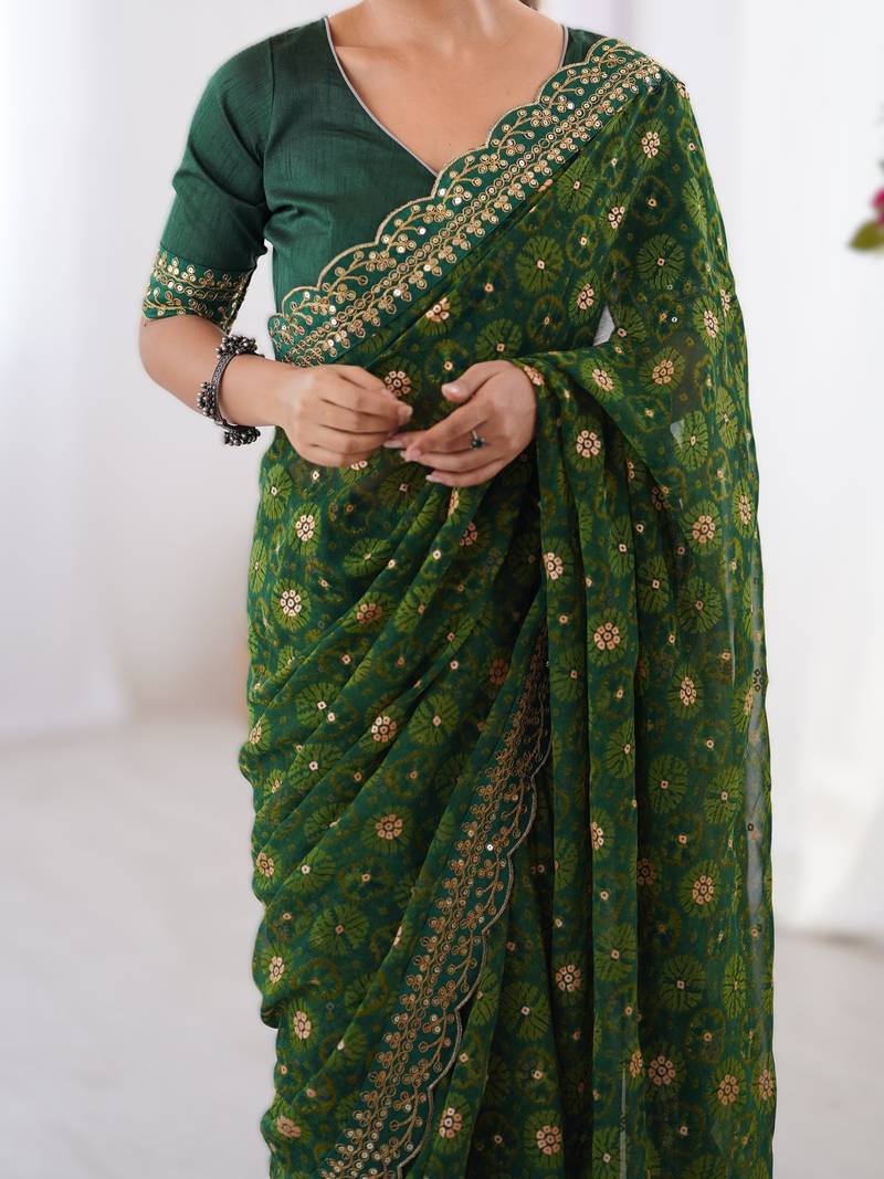 Green floral printed georgette chiffon saree with foil work & embroidered lace border