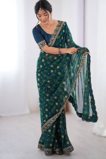 Teal  floral printed georgette chiffon saree with foil work & embroidered lace border