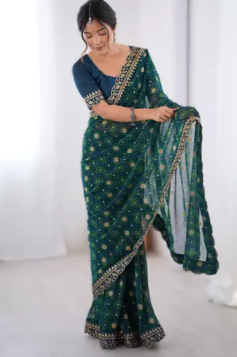 Teal  floral printed georgette chiffon saree with foil work & embroidered lace border
