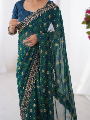 Teal floral printed georgette chiffon saree with foil work & embroidered lace border 2