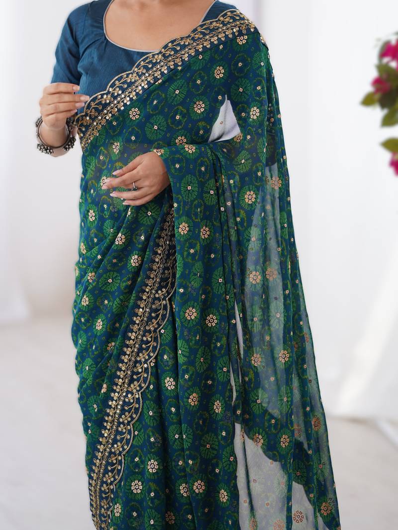Teal  floral printed georgette chiffon saree with foil work & embroidered lace border