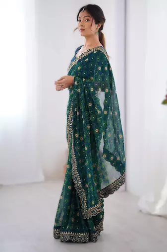 Teal floral printed georgette chiffon saree with foil work & embroidered lace border