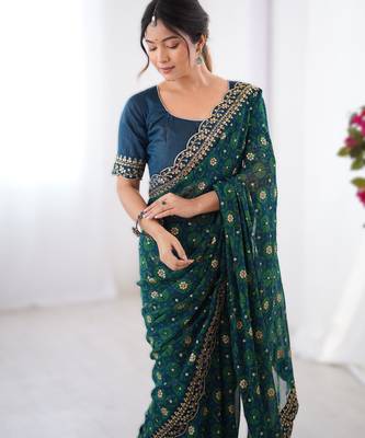 Teal floral printed georgette chiffon saree with foil work & embroidered lace border 4
