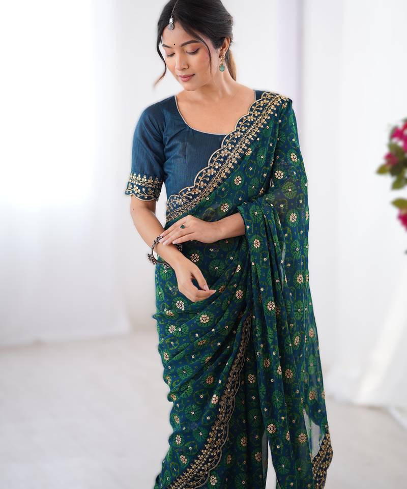 Teal  floral printed georgette chiffon saree with foil work & embroidered lace border