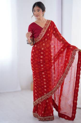 Red floral printed georgette chiffon saree with foil work & embroidered lace border