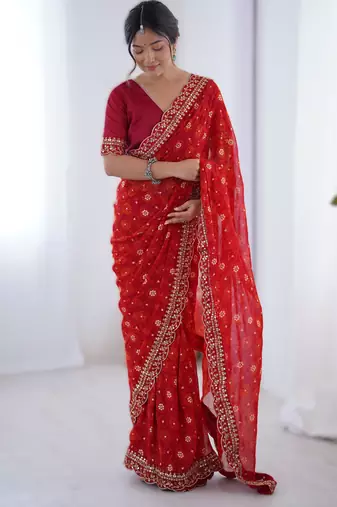 Red floral printed georgette chiffon saree with foil work & embroidered lace border