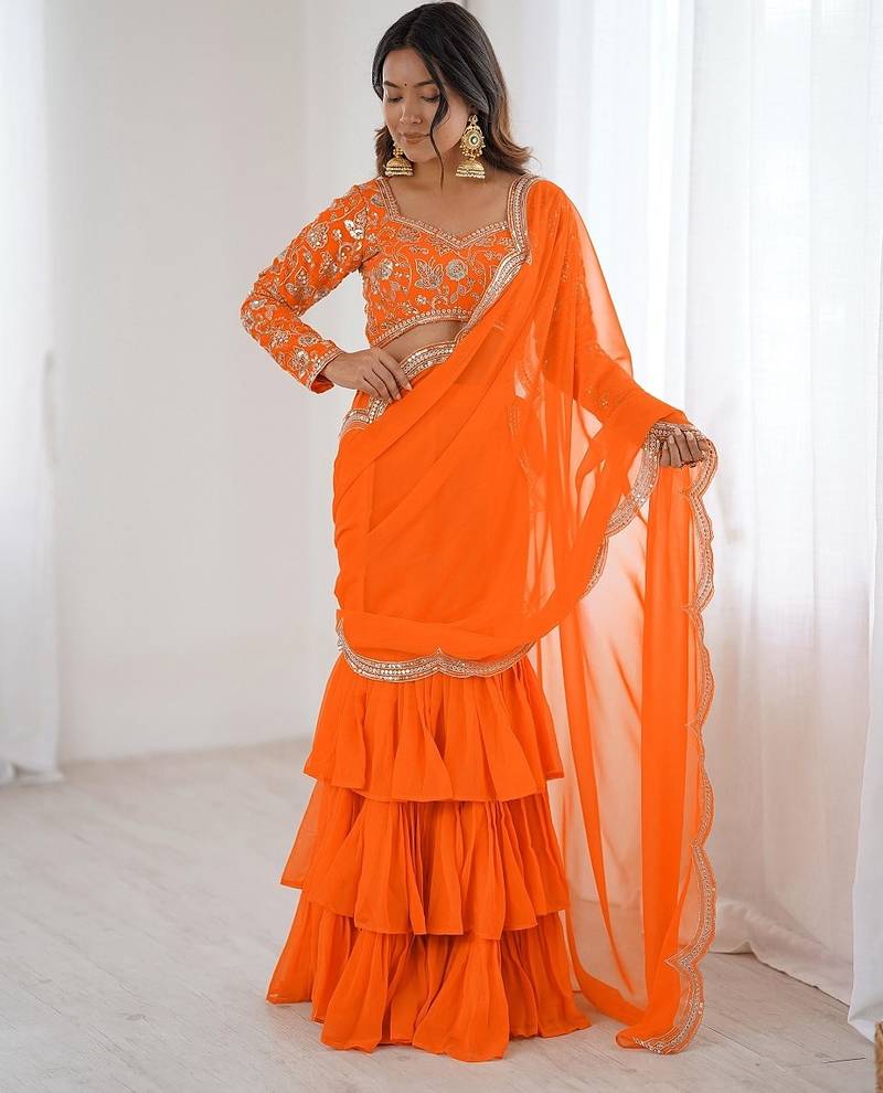 orange color faux georgette thread sequince work ruffle saree with blouse