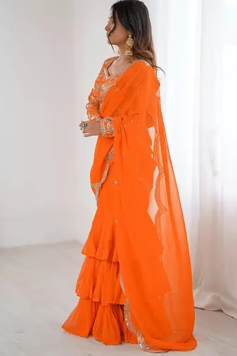 orange color faux georgette thread sequince work ruffle saree with blouse
