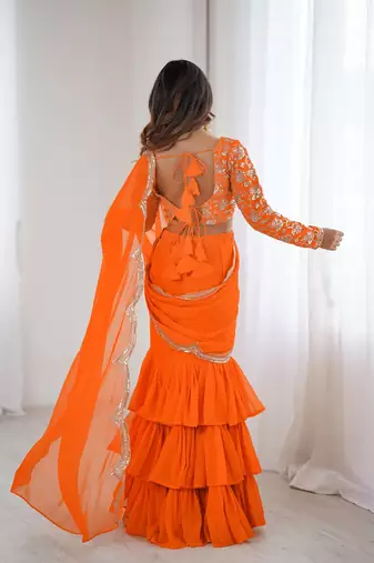 orange color faux georgette thread sequince work ruffle saree with blouse