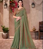 sage green georgette saree with heavy golden embroidery