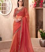 rust orange tissue saree with heavy embroidery and sequins