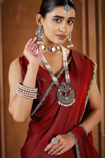 Party wear new rangoli silk red color saree with blouse and stone lace border