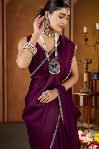 Party wear new rangoli silk wine color saree with blouse and stone lace border