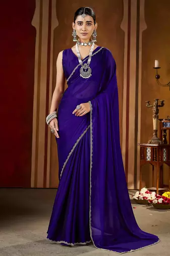 Party wear new rangoli silk violet color saree with blouse and stone lace border