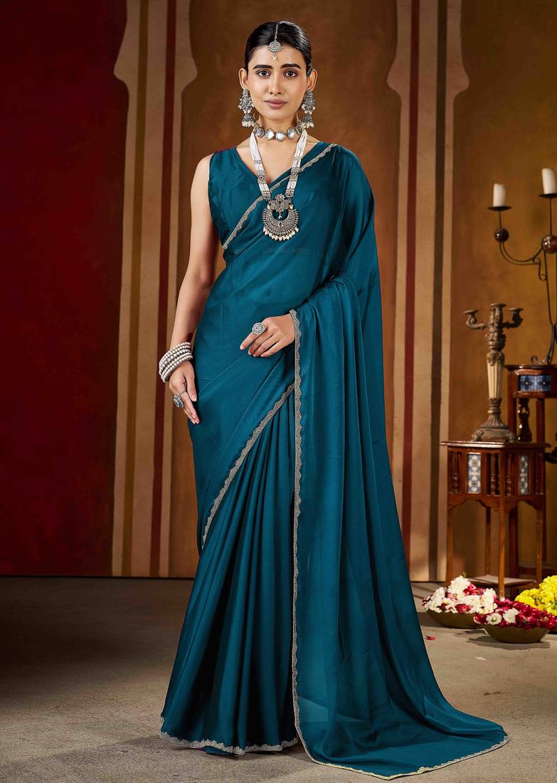 Party wear new rangoli silk rama color saree with blouse and stone lace border