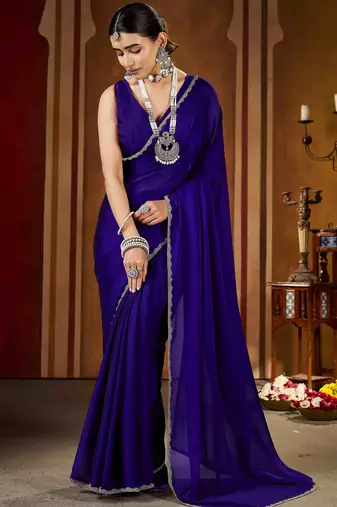 Party wear new rangoli silk violet color saree with blouse and stone lace border