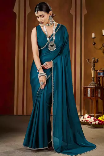 Party wear new rangoli silk rama color saree with blouse and stone lace border