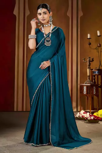 Party wear new rangoli silk rama color saree with blouse and stone lace border