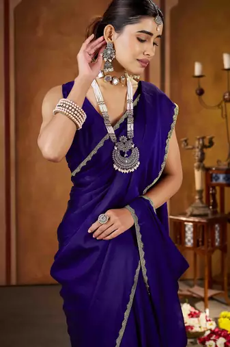 Party wear new rangoli silk violet color saree with blouse and stone lace border