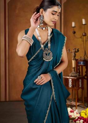 Party wear new rangoli silk rama color saree with blouse and stone lace border 4
