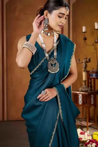 Party wear new rangoli silk rama color saree with blouse and stone lace border