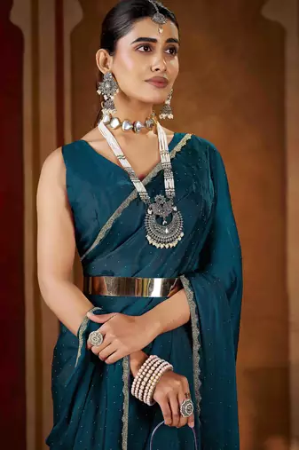 Festive rama green rangoli silk saree with beads lace design