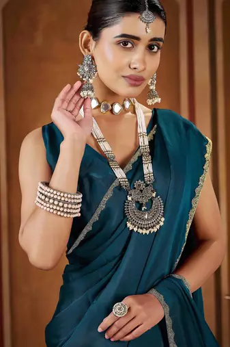 Party wear new rangoli silk rama color saree with blouse and stone lace border