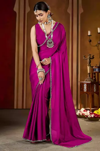 Party wear new rangoli silk pink color saree with blouse and stone lace border