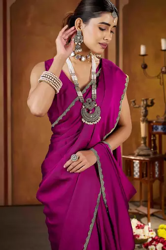 Party wear new rangoli silk pink color saree with blouse and stone lace border