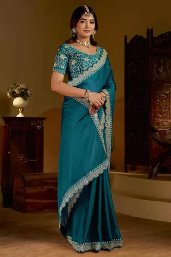 Rama green rangoli silk saree with heavy embroidery work and heavy work
