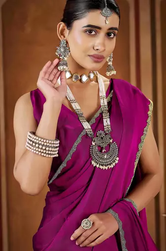 Party wear new rangoli silk pink color saree with blouse and stone lace border