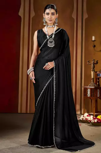 Party wear new rangoli silk black color saree with blouse and stone lace border