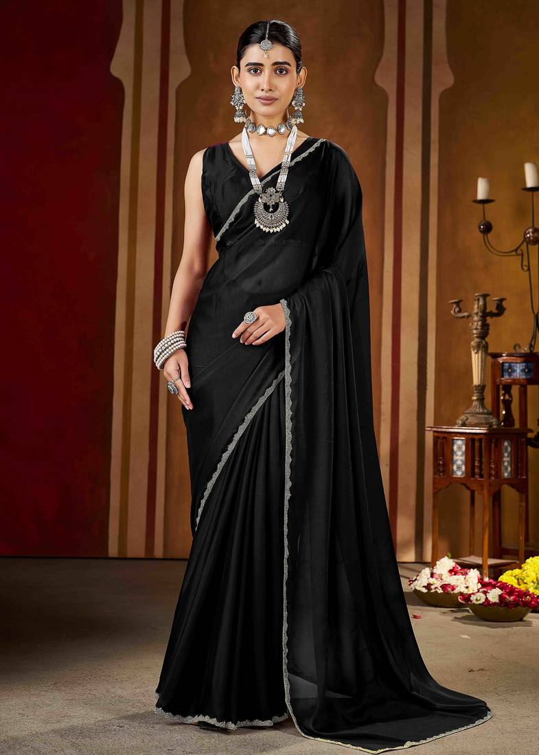 Party wear new rangoli silk black color saree with blouse and stone lace border