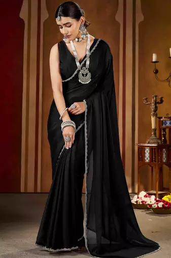 Party wear new rangoli silk black color saree with blouse and stone lace border