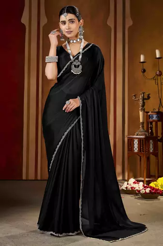 Party wear new rangoli silk black color saree with blouse and stone lace border